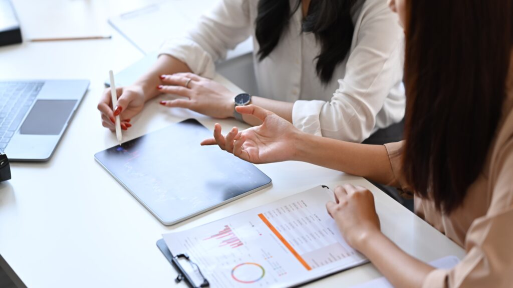 Two people presenting office work